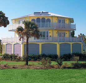 Two-story luxury stilt home design built oceanfront with ground level breakaway walls. Coastal South Carolina