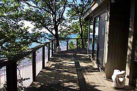 Stainless steel cable railing and composite deck, overlooking the beach. Coastal Oregon