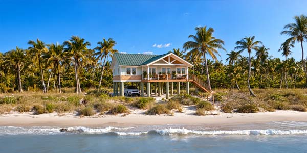 One-story elevated Topsider home on a wooded waterfront site One-story elevated Topsider home on a wooded waterfront site